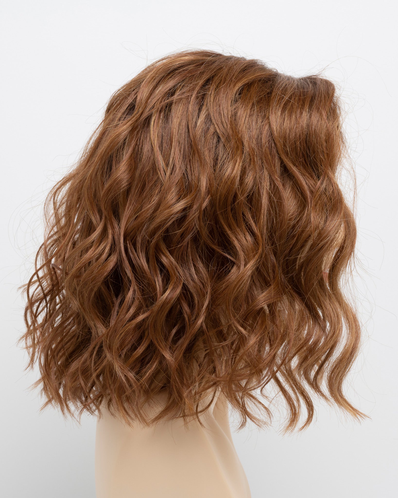 profile side of a medium Kinner Beauty Wigs wig for woman on mannequin head