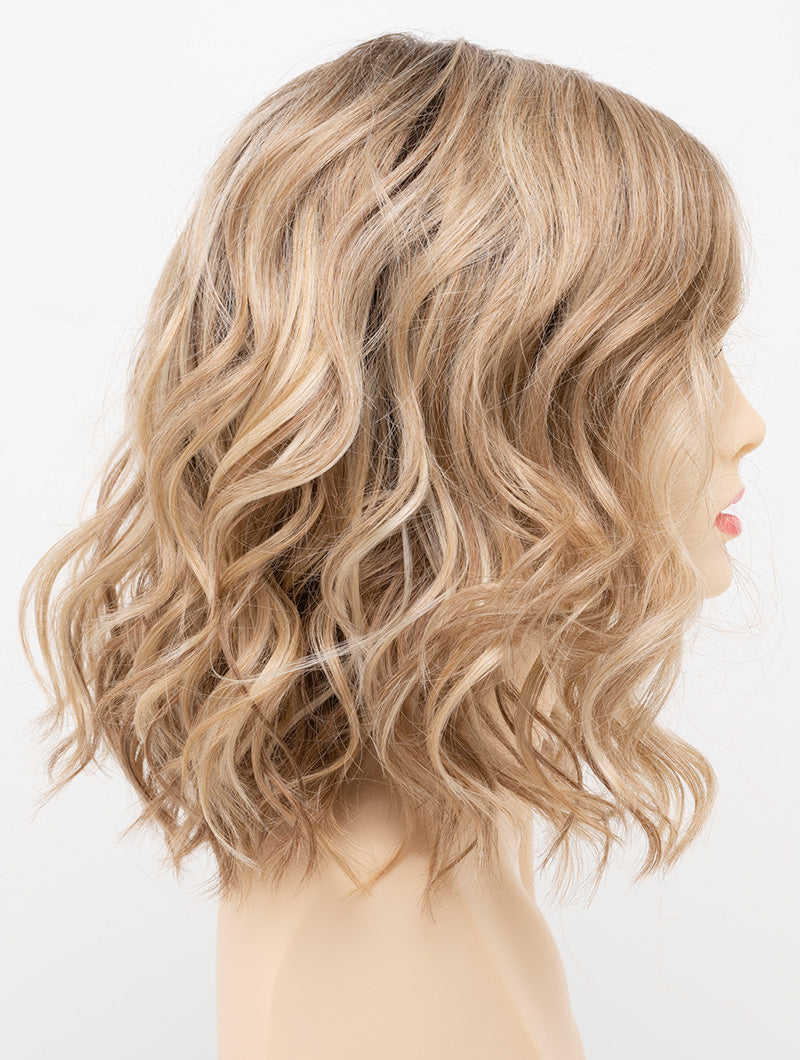profile side of a medium Kinner Beauty Wigs wig for woman on mannequin head