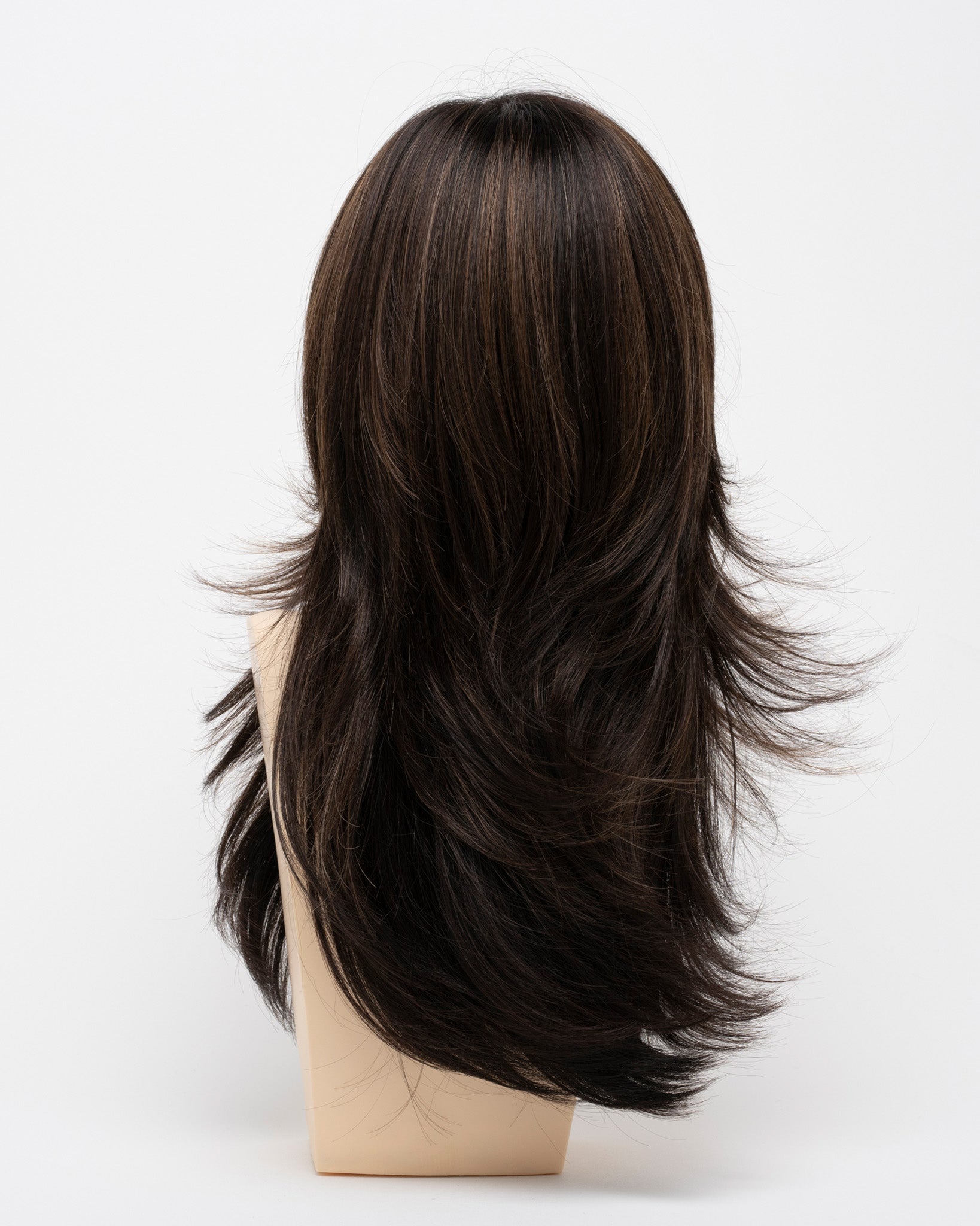 back side of a long Kinner Beauty Wigs wig for woman on mannequin head