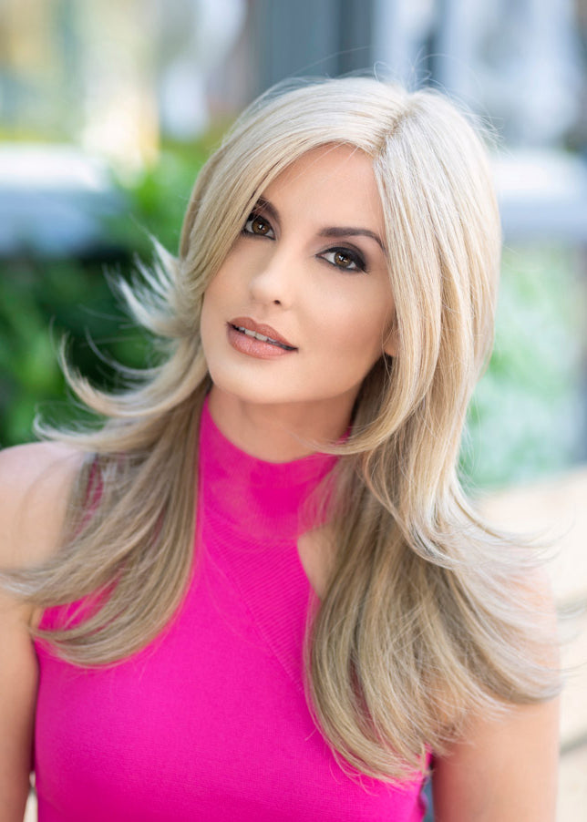 front side of a long Kinner Beauty Wigs wig on woman head