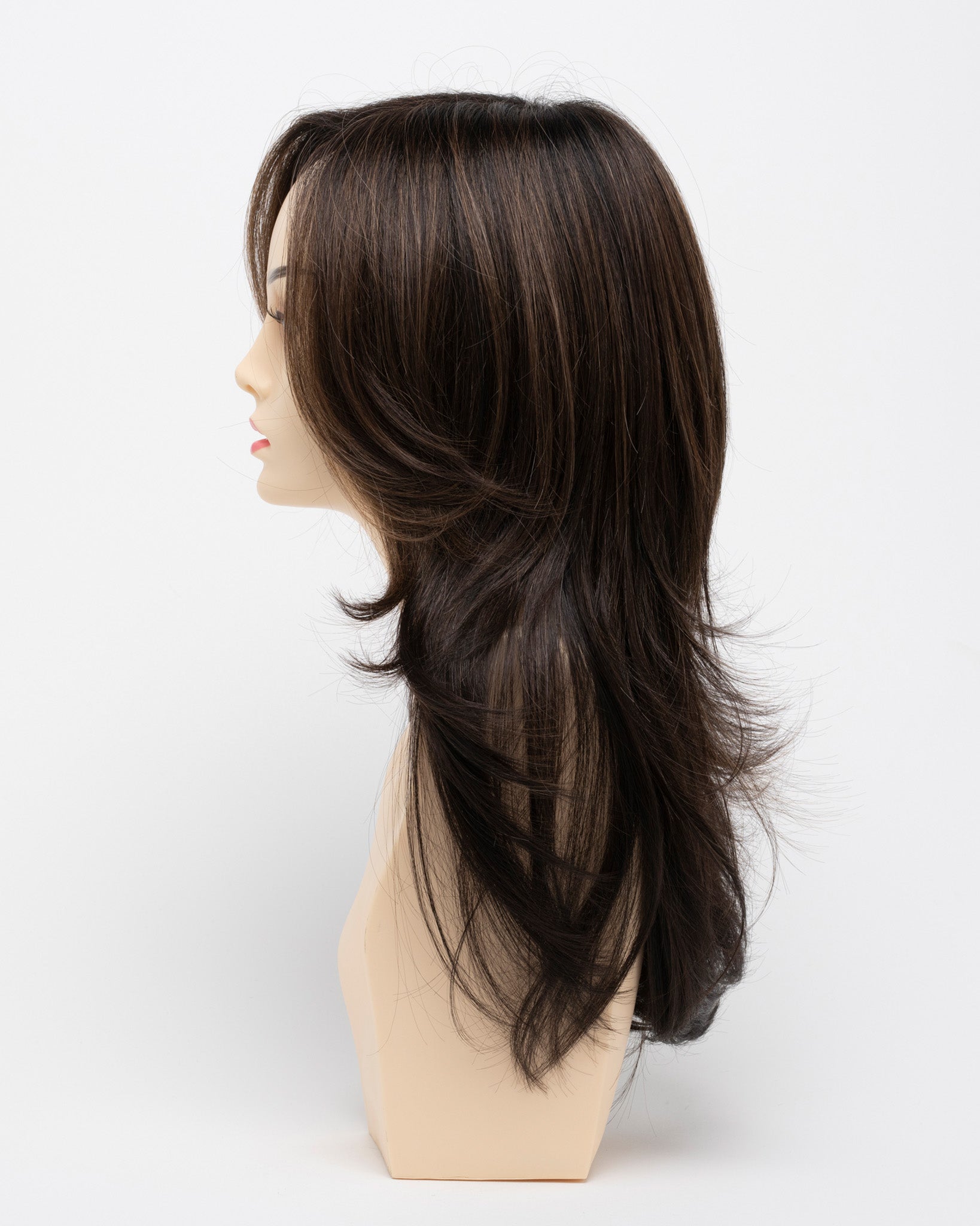 profile side of a long Kinner Beauty Wigs wig for woman on mannequin head
