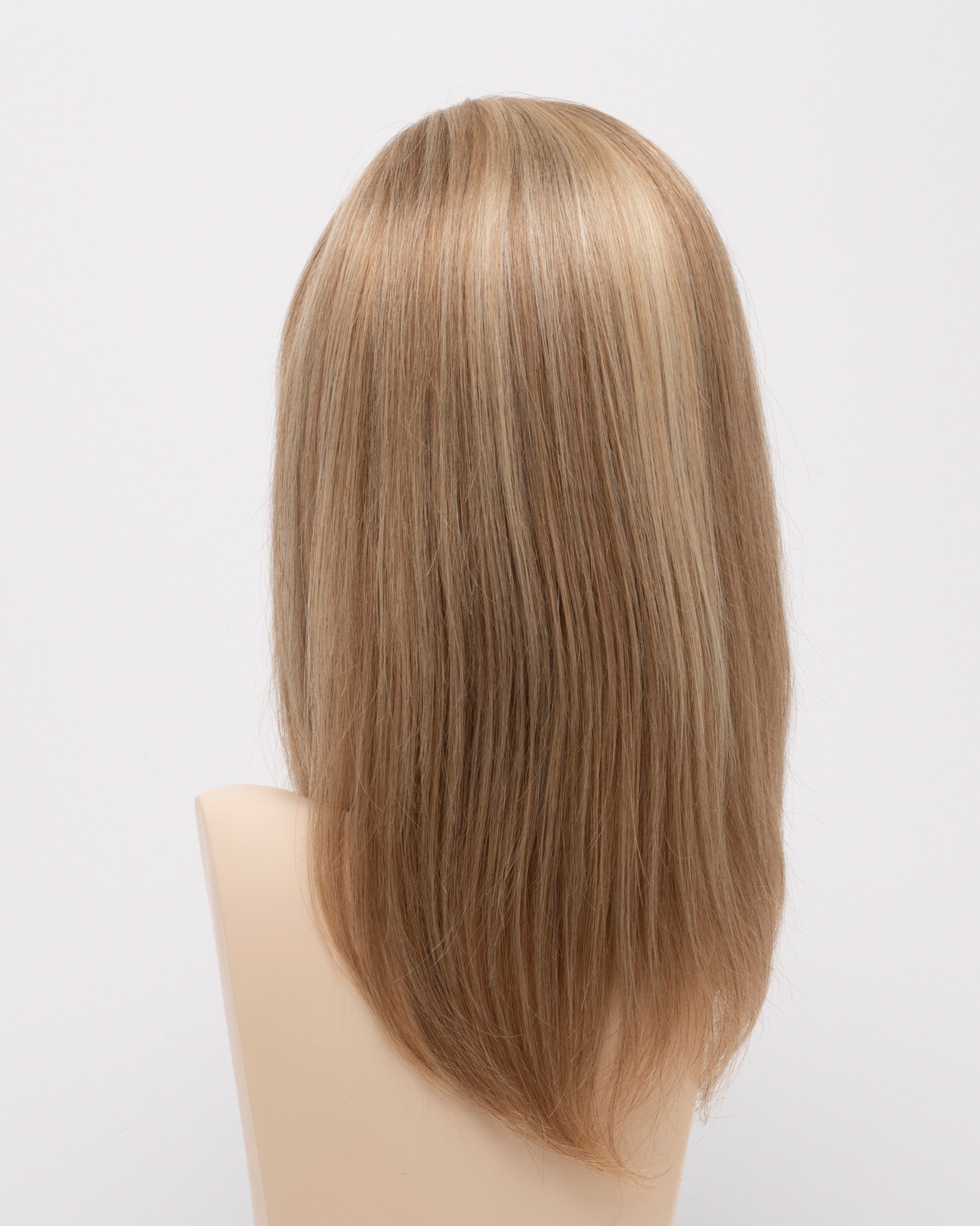 back side of a medium Kinner Beauty Wigs wig for woman on mannequin head