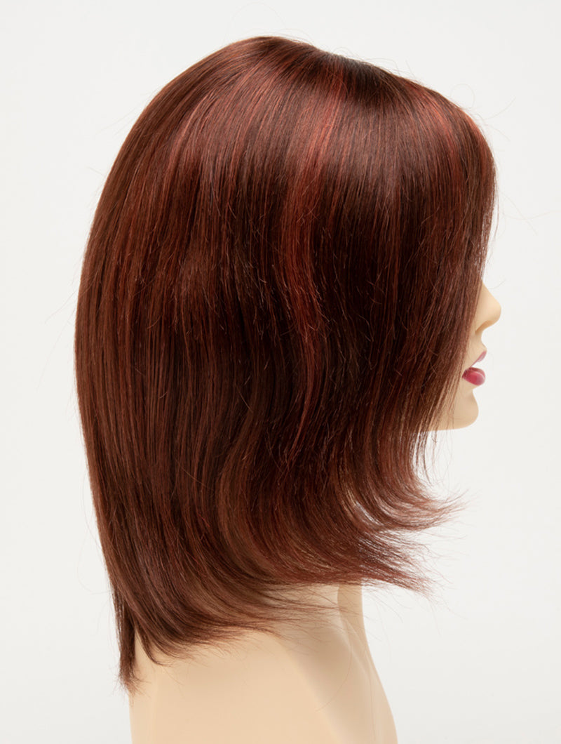 profile side of a medium Kinner Beauty Wigs wig for woman on mannequin head