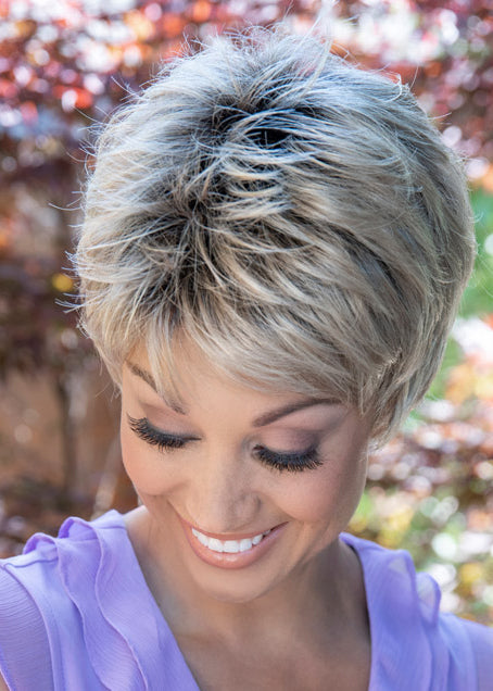 front side of a short Kinner Beauty Wigs wig for woman on mannequin head