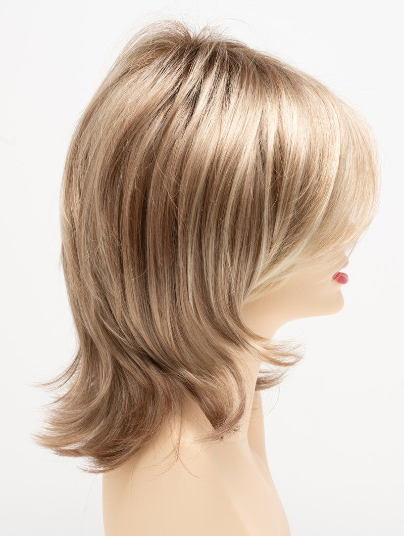 profile side of a medium Kinner Beauty Wigs wig for woman on mannequin head