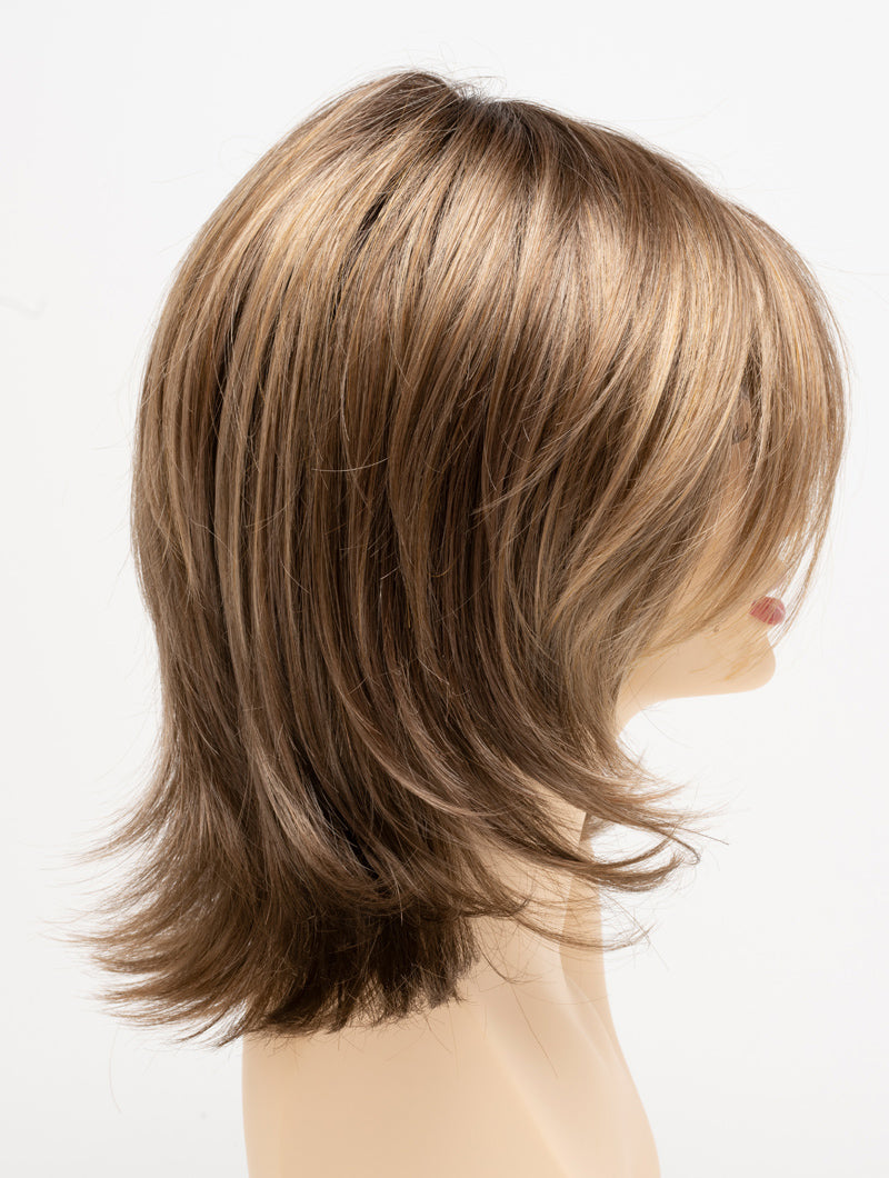 profile side of a medium Kinner Beauty Wigs wig for woman on mannequin head