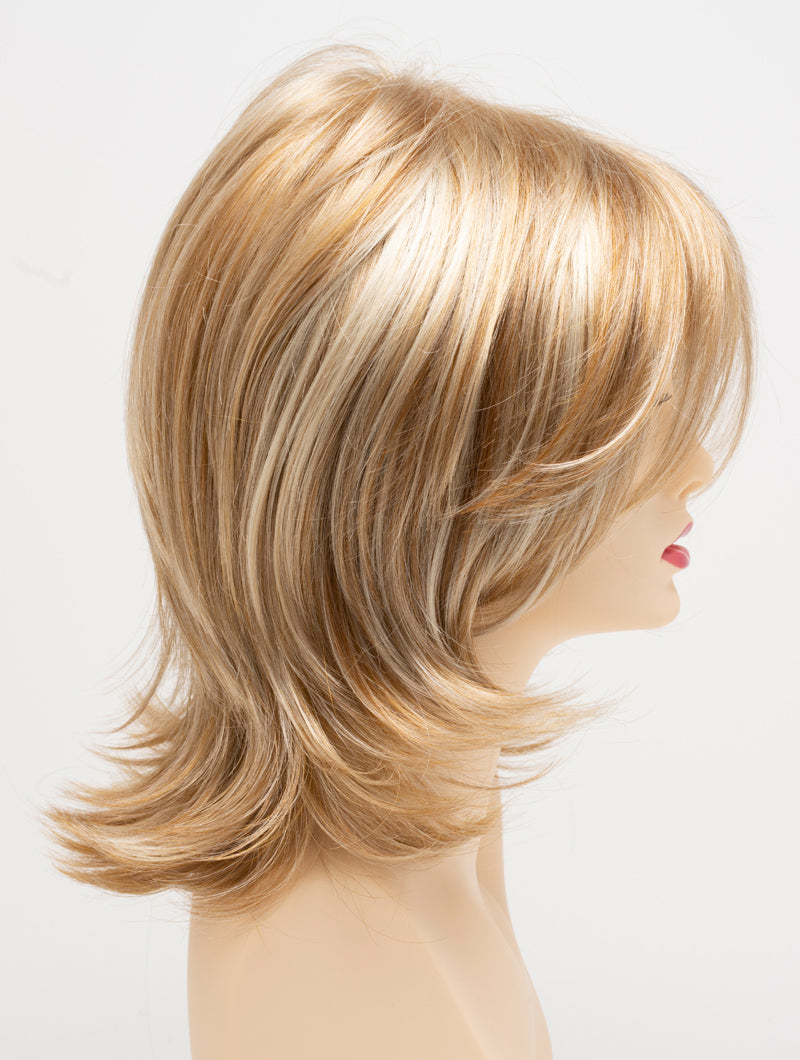 profile side of a medium Kinner Beauty Wigs wig for woman on mannequin head