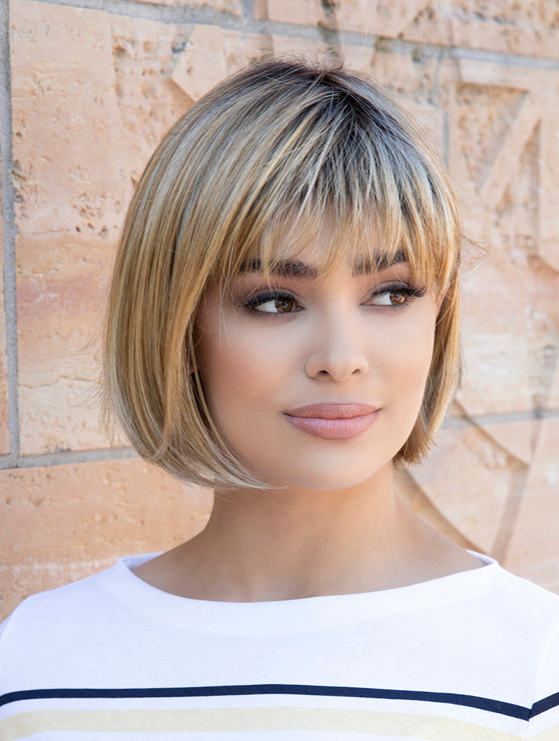 front side of a short Kinner Beauty Wigs wig on woman head
