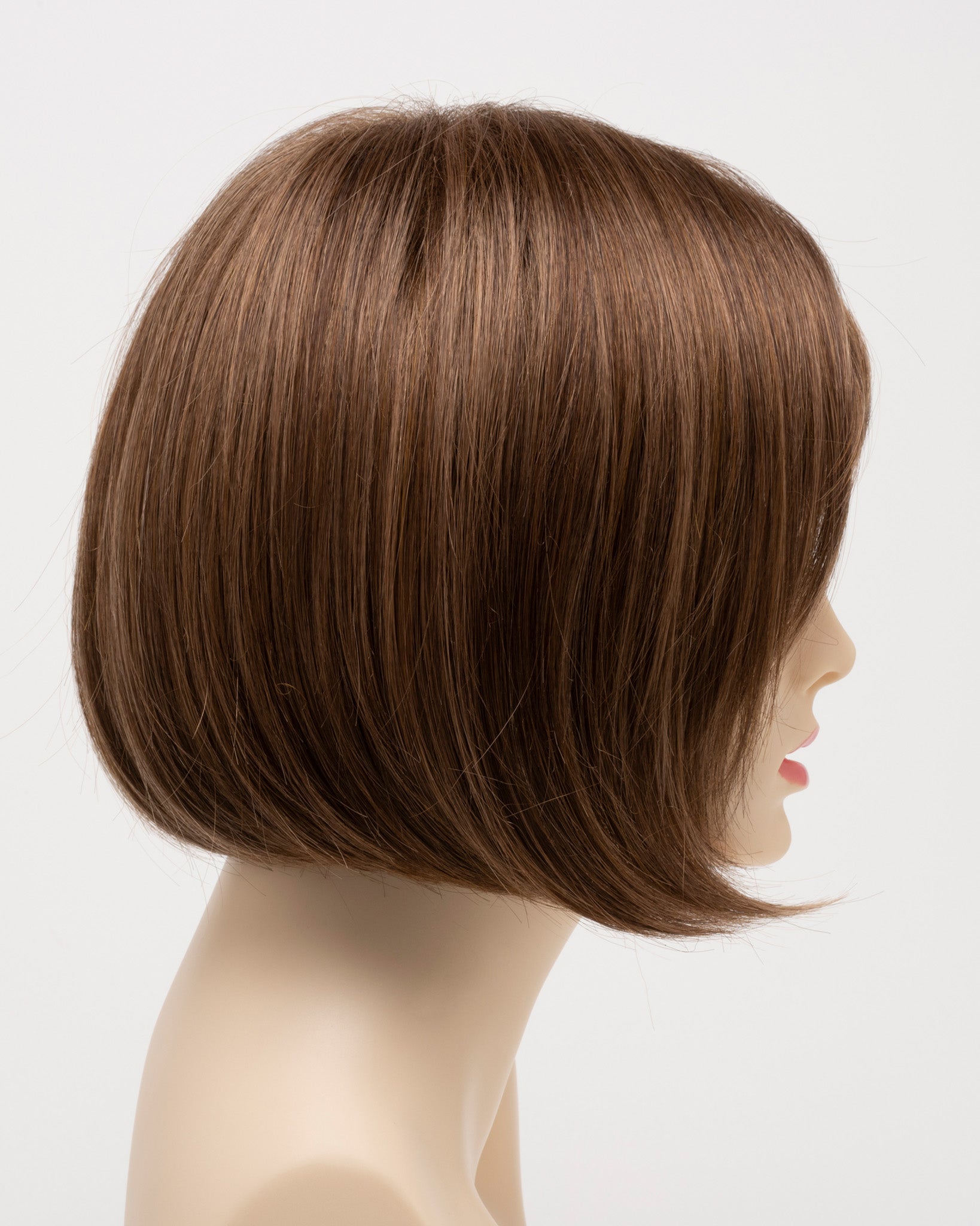 profile side of a short Kinner Beauty Wigs wig on woman head