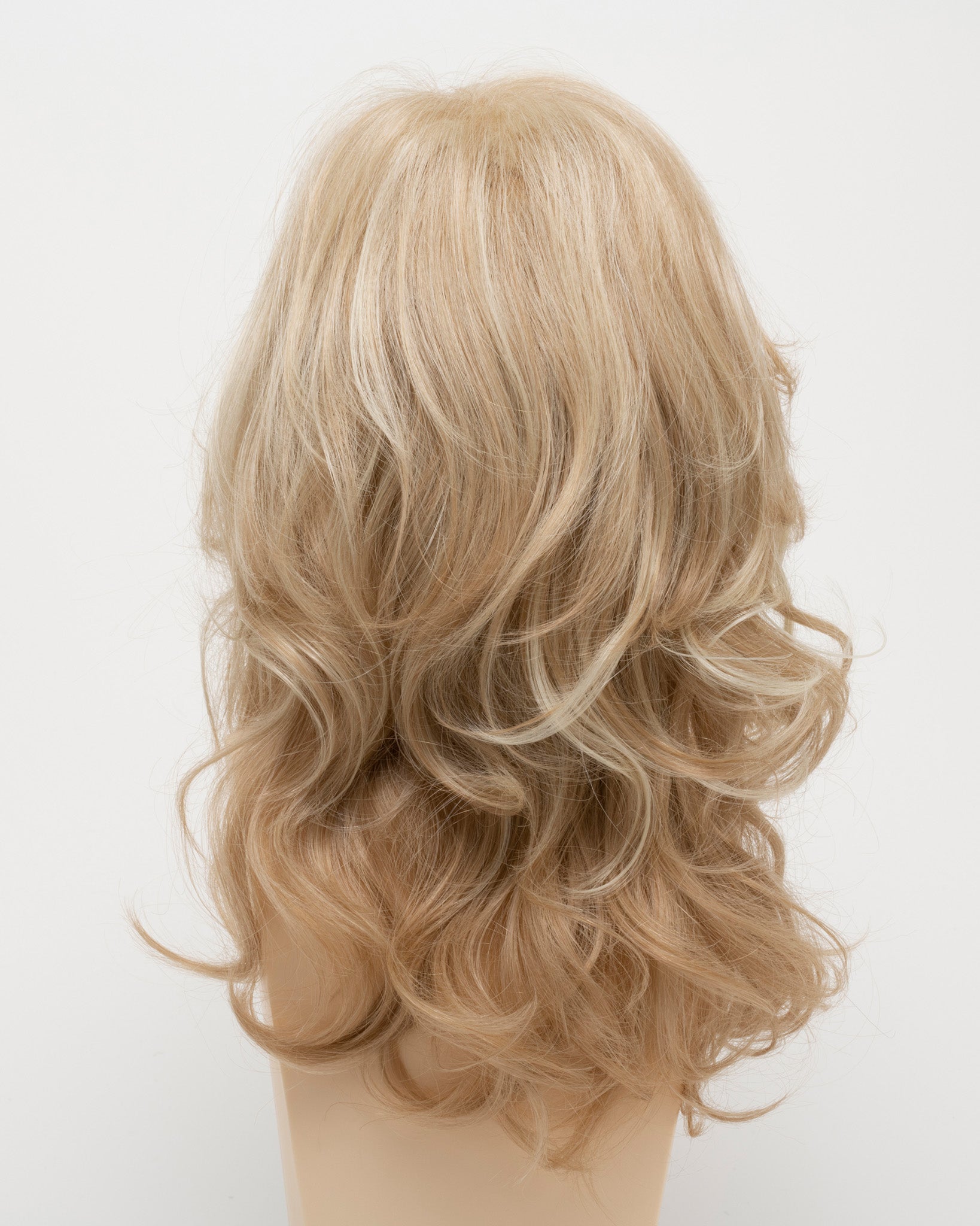 back side of a long Kinner Beauty Wigs wig for woman on mannequin head