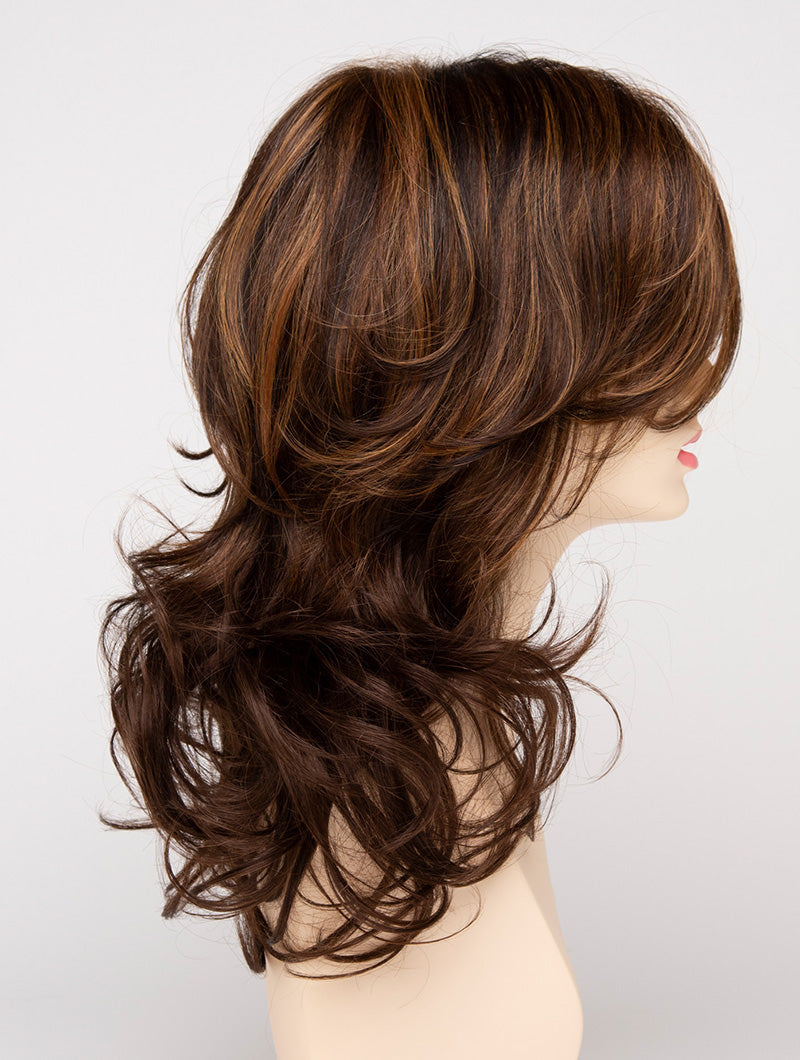profile side of a long Kinner Beauty Wigs wig for woman on mannequin head