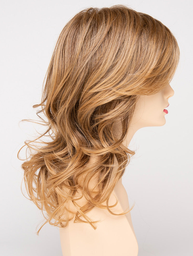 profile side of a long Kinner Beauty Wigs wig for woman on mannequin head