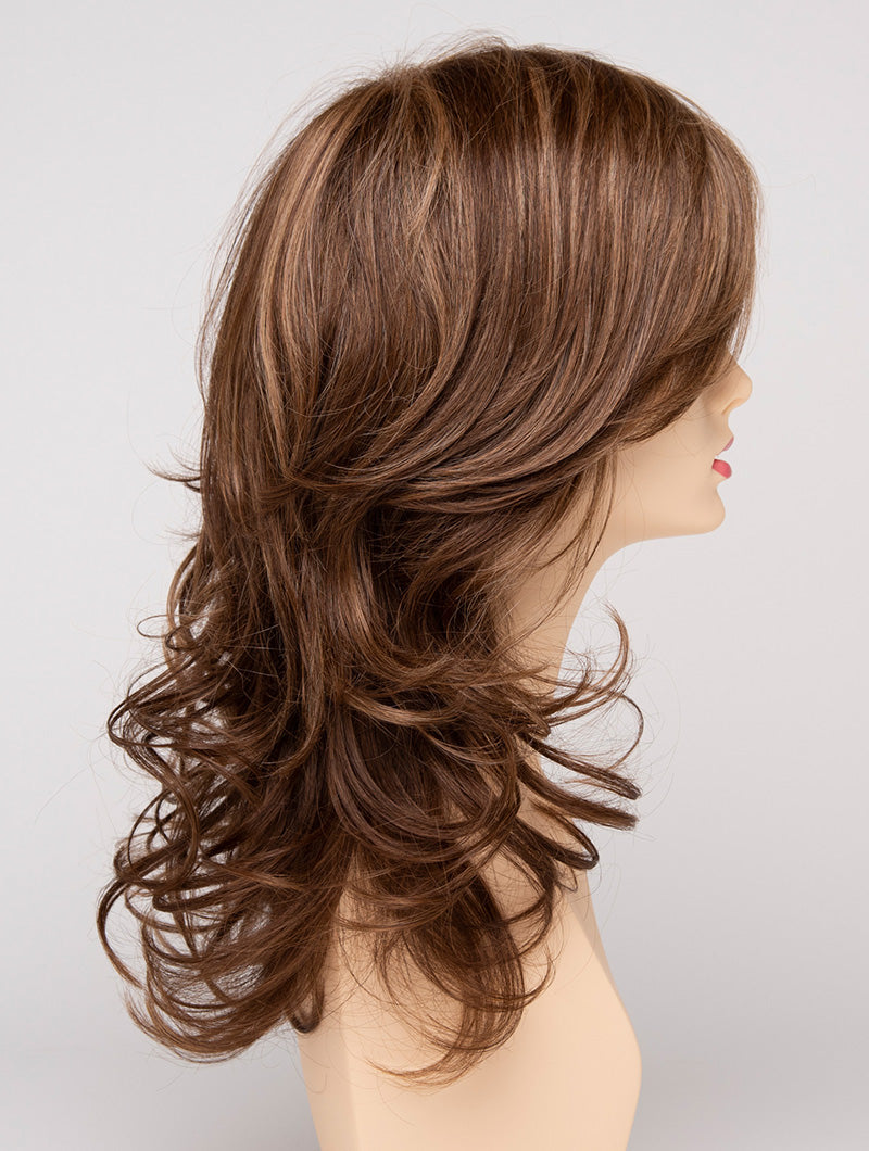 profile side of a long Kinner Beauty Wigs wig for woman on mannequin head