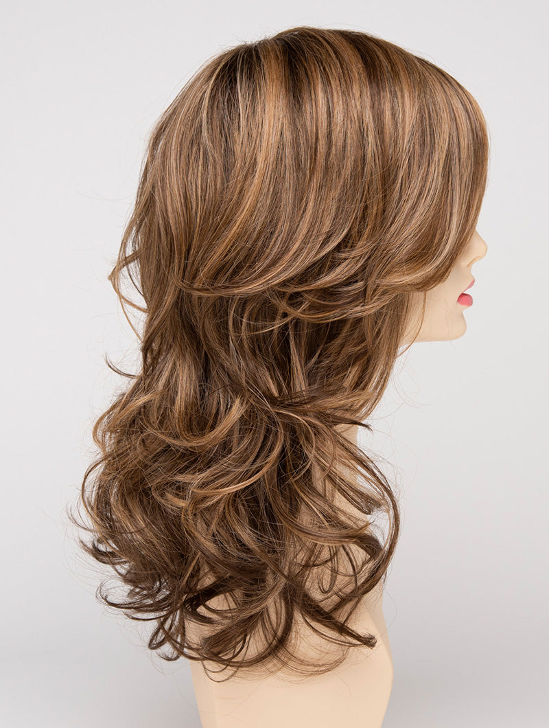 profile side of a long Kinner Beauty Wigs wig for woman on mannequin head