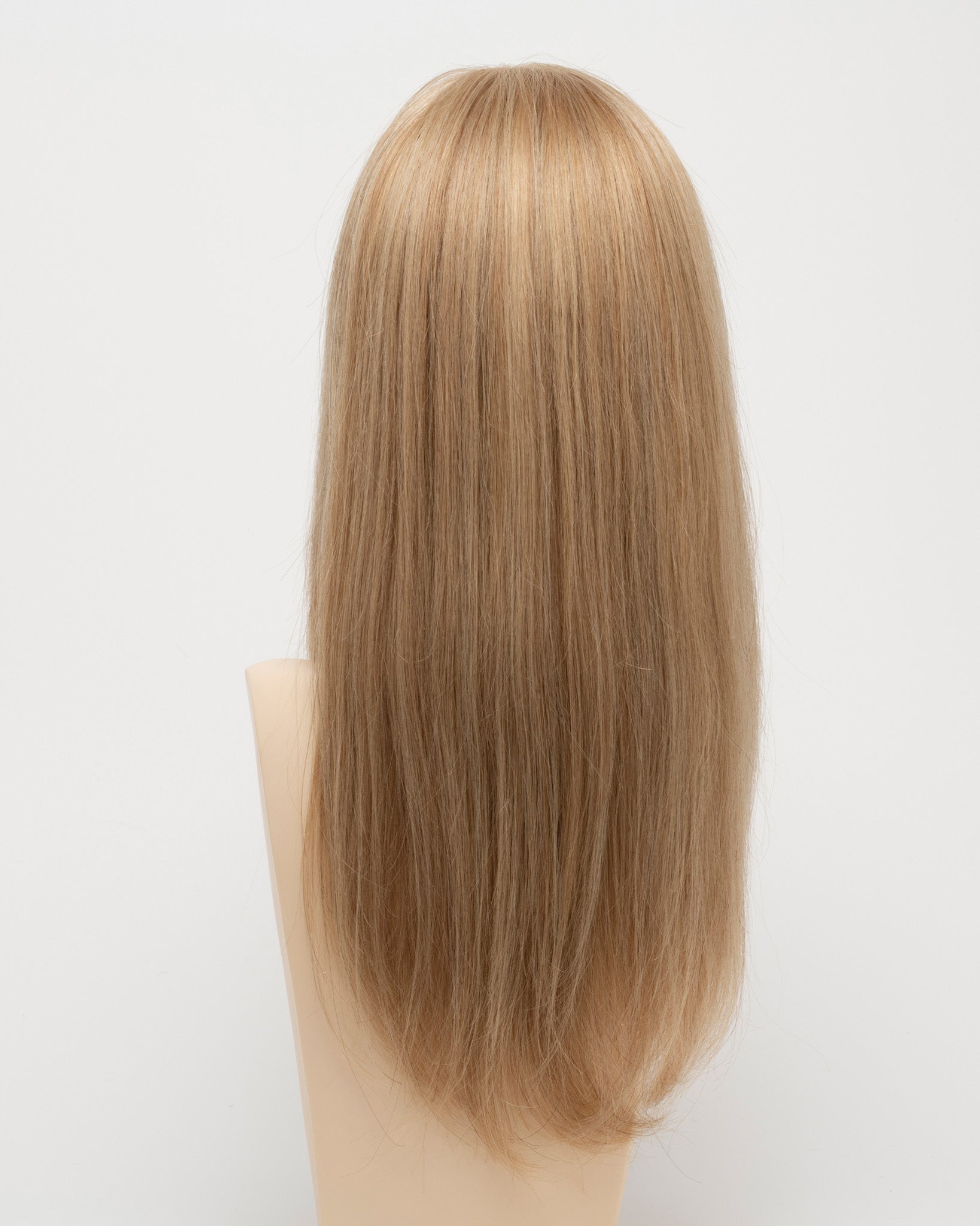back side of a long Kinner Beauty Wigs wig for woman on mannequin head