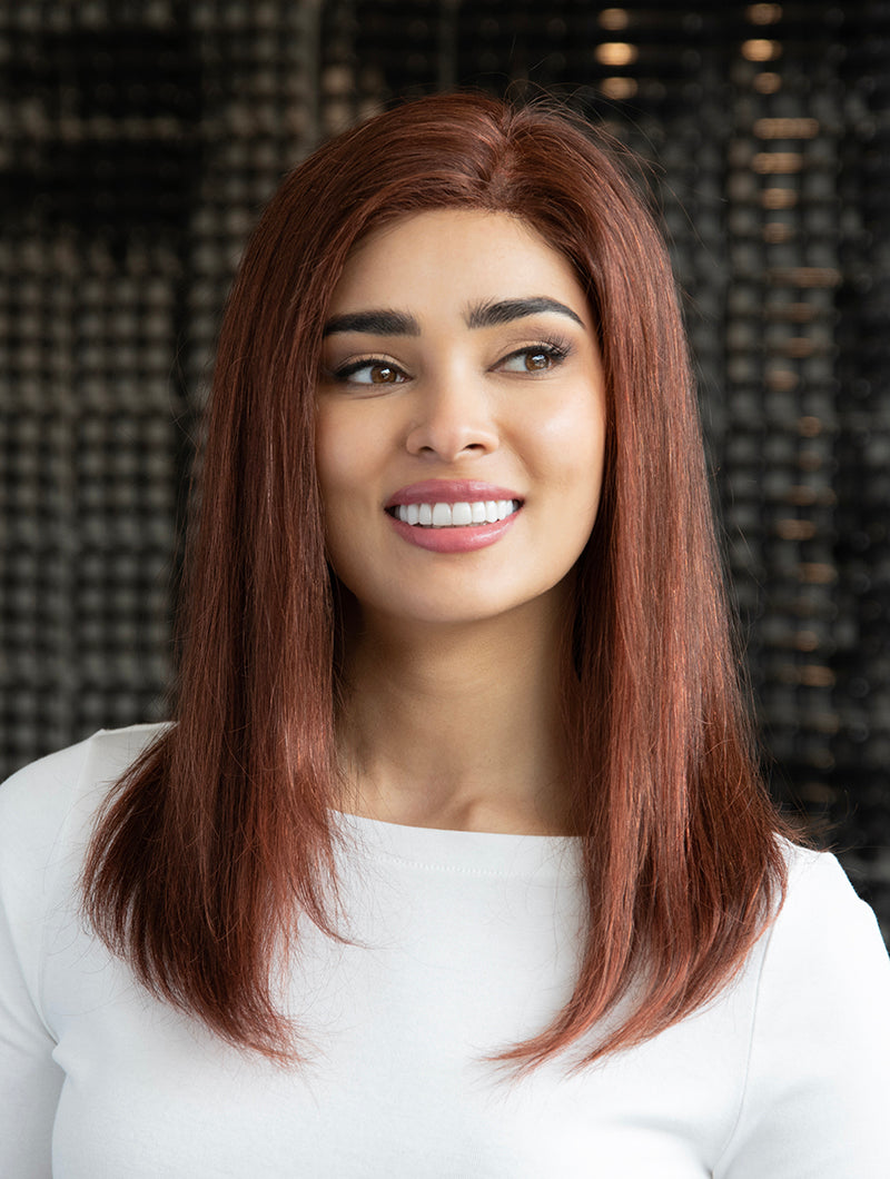 front side of a long Kinner Beauty Wigs wig on woman head