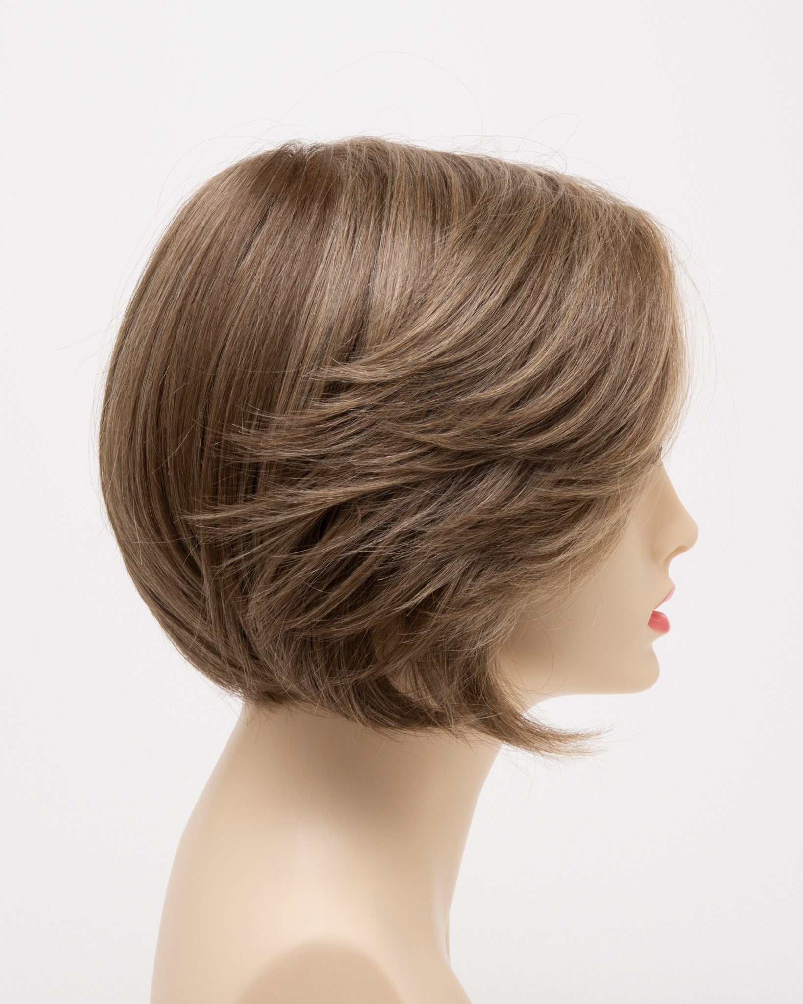 profile side of a short Kinner Beauty Wigs wig for woman on mannequin head 