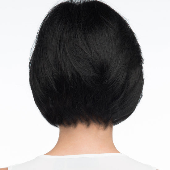 back side of a short Kinner Beauty Wigs wig on woman head 