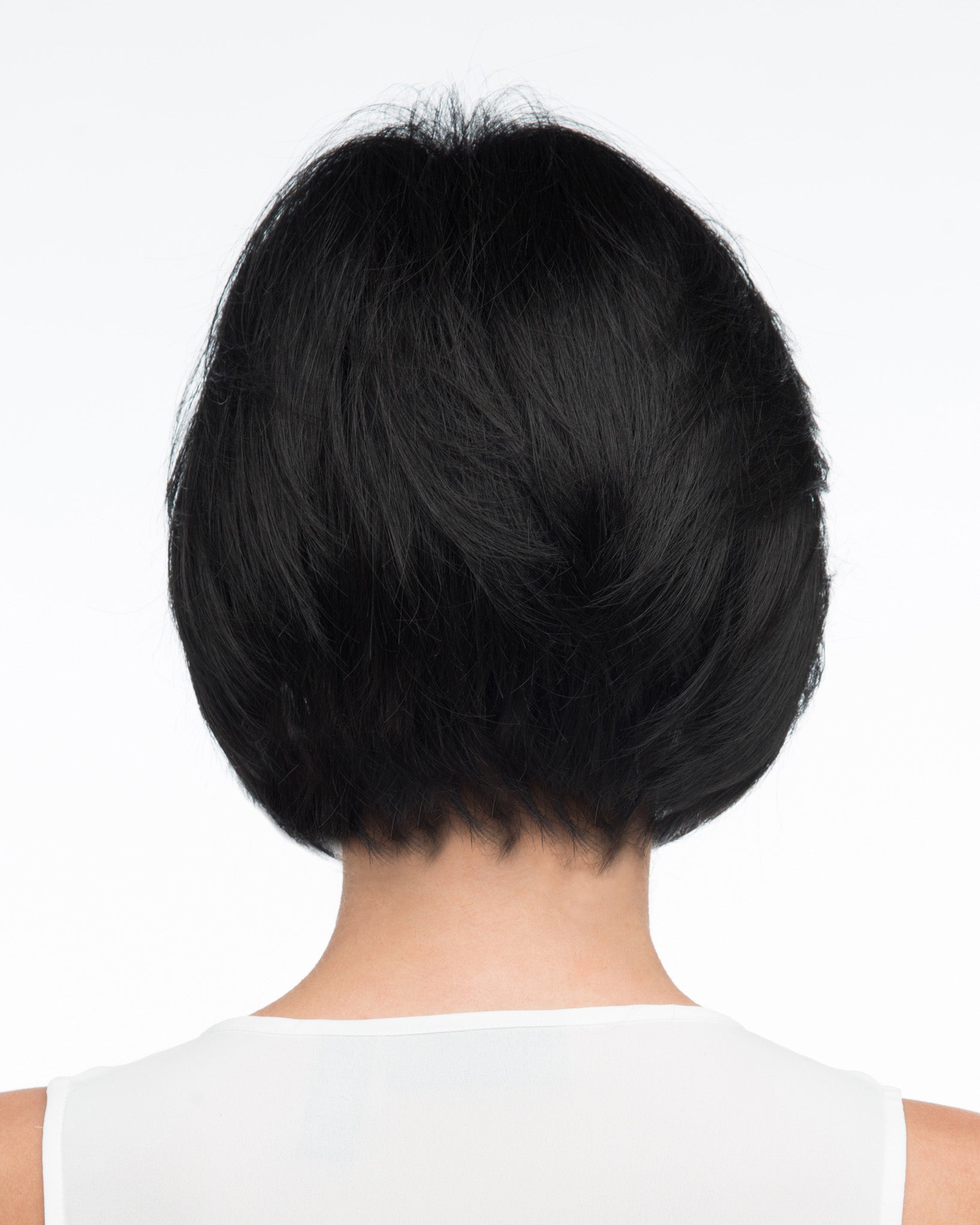 back side of a short Kinner Beauty Wigs wig on woman head 