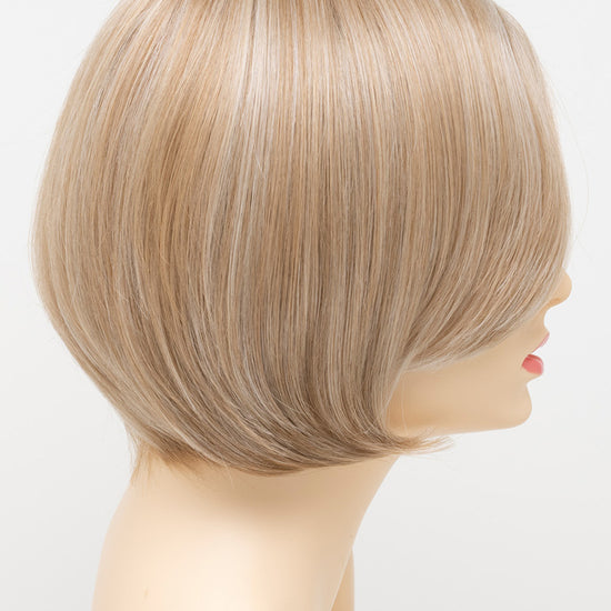 profile side of a short Kinner Beauty Wigs wig for woman on mannequin head 