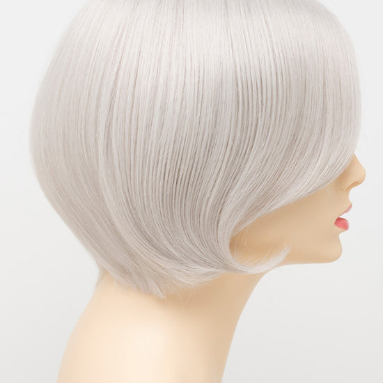 profile side of a short Kinner Beauty Wigs wig for woman on mannequin head 