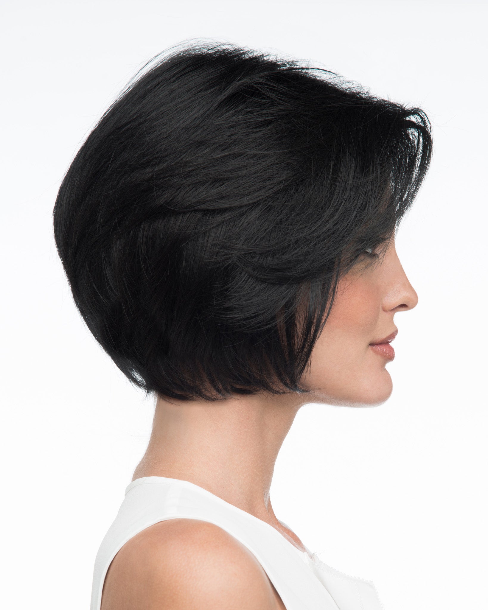 profile side of a short Kinner Beauty Wigs wig on woman head 