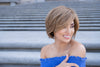 profile side of a short Kinner Beauty Wigs wig on woman head 