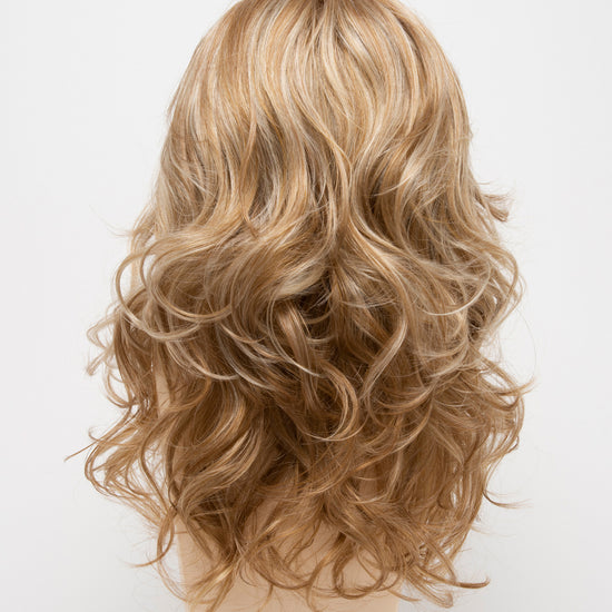 back side of a long Kinner Beauty Wigs wig for woman on mannequin head 