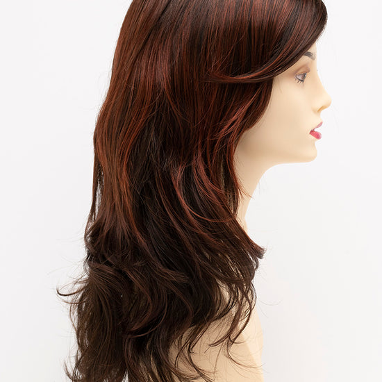 profile side of a long Kinner Beauty Wigs wig for woman on mannequin head 