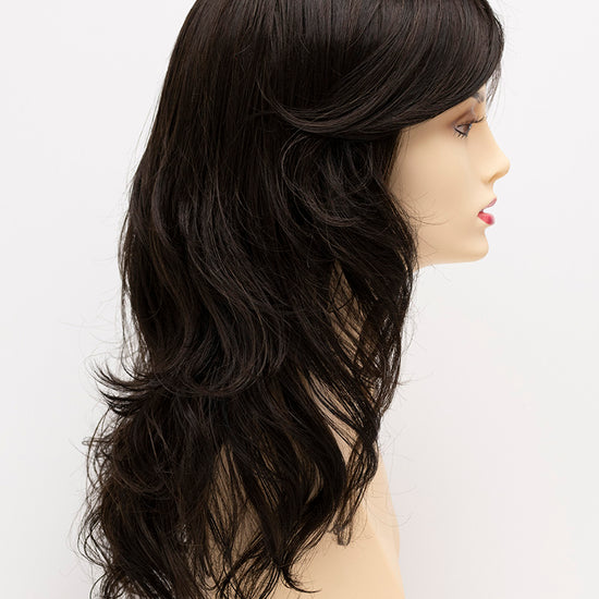 profile side of a long Kinner Beauty Wigs wig for woman on mannequin head 