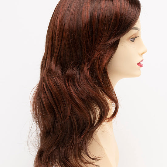 profile side of a long Kinner Beauty Wigs wig for woman on mannequin head 