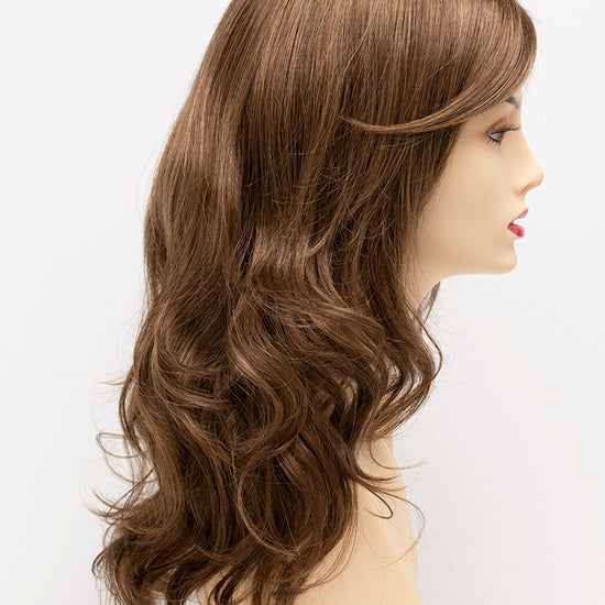 profile side of a long Kinner Beauty Wigs wig for woman on mannequin head 