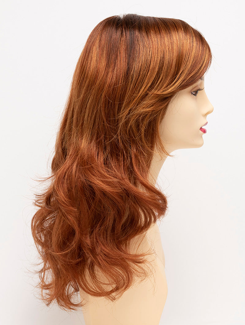 profile side of a long Kinner Beauty Wigs wig for woman on mannequin head 