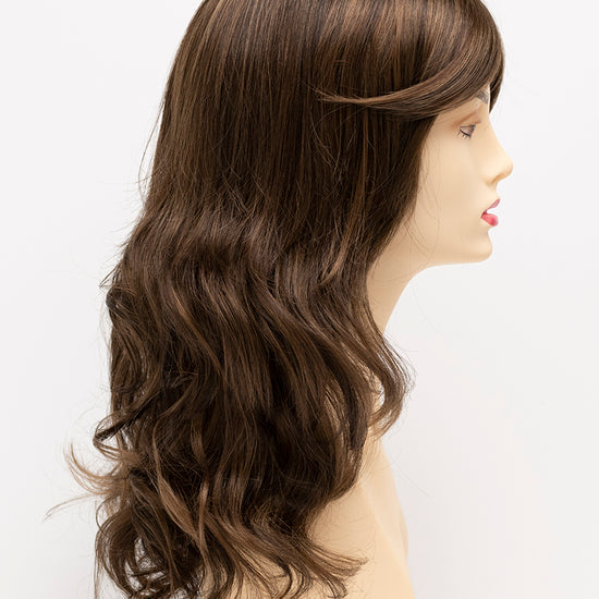 profile side of a long Kinner Beauty Wigs wig for woman on mannequin head 