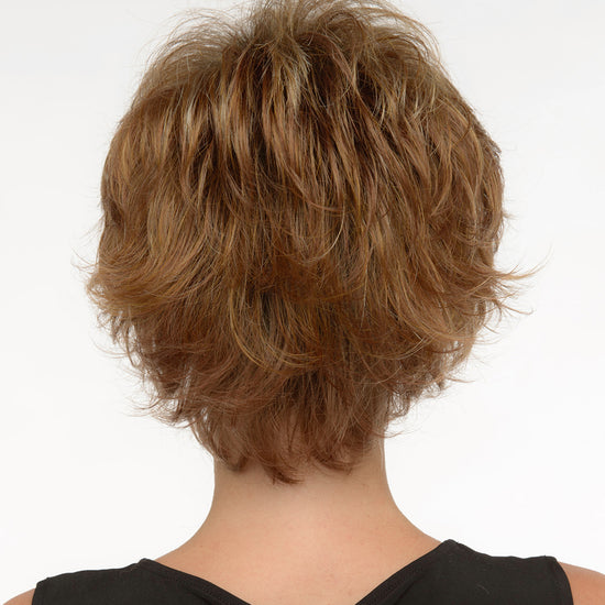 back side of a short Kinner Beauty Wigs wig on woman head 