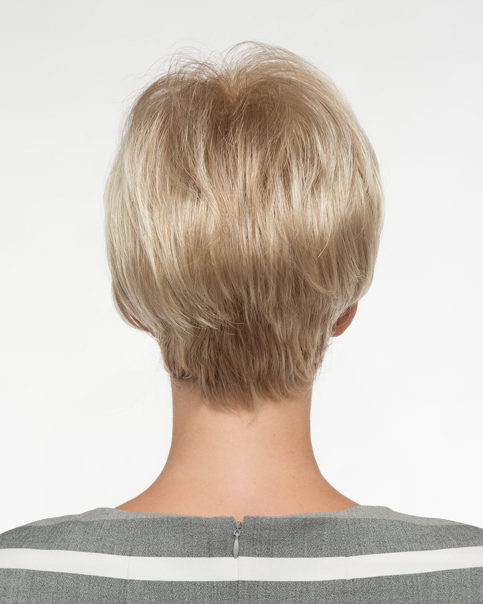 back side of a short Kinner Beauty Wigs wig on woman head 