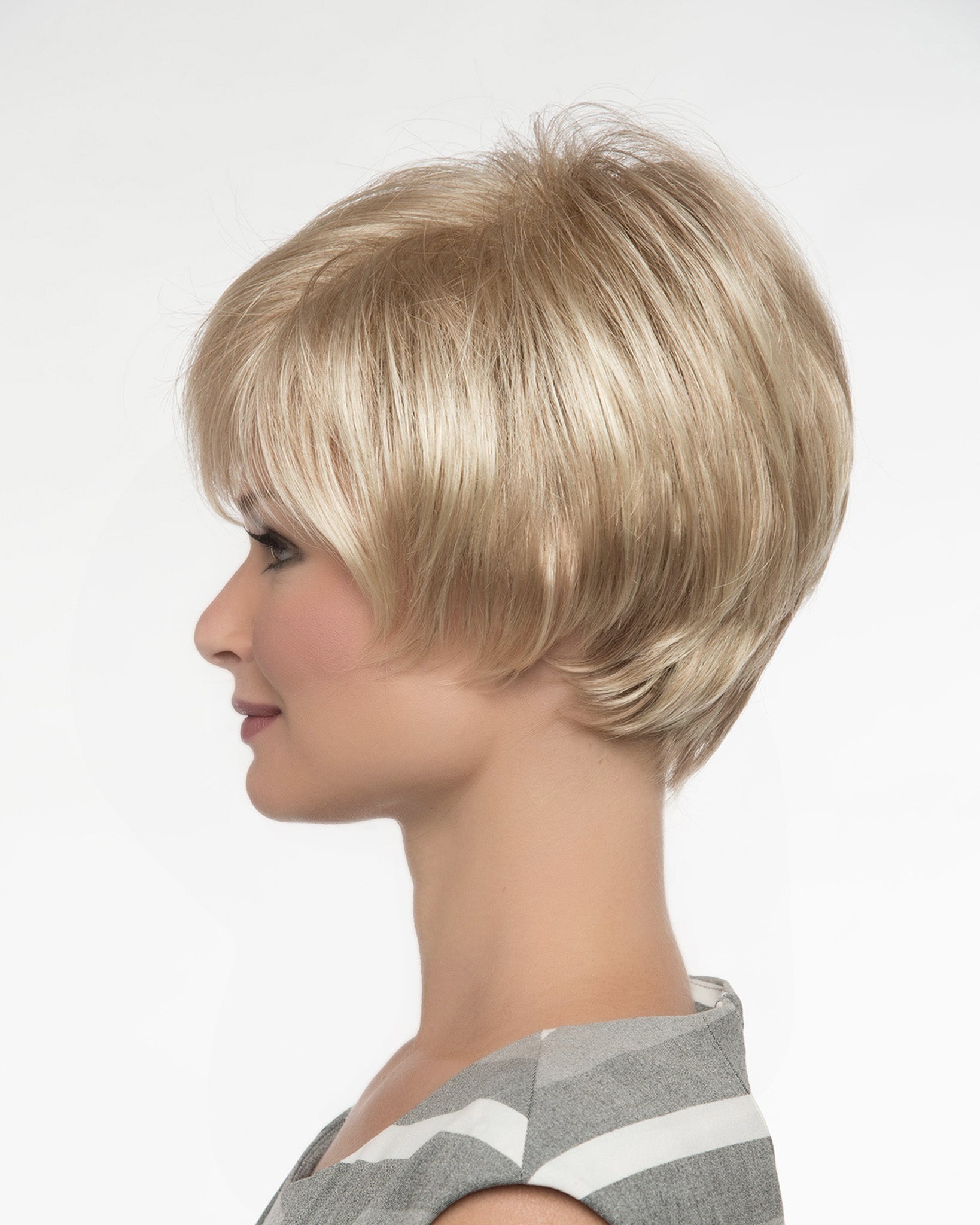 profile side of a short Kinner Beauty Wigs wig on woman head 