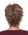 back side of a short Kinner Beauty Wigs wig on woman head 