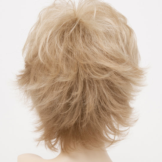 back side of a short Kinner Beauty Wigs wig for woman on mannequin head 