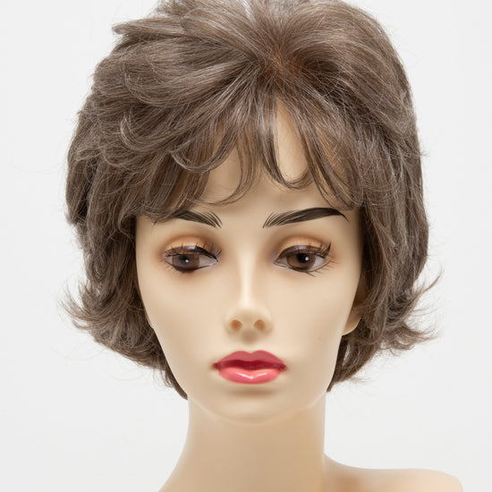 front side of a short Kinner Beauty Wigs wig for woman on mannequin head 