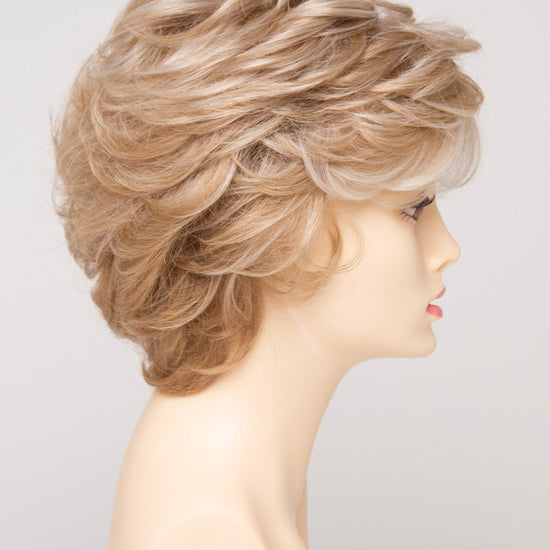 profile side of a short Kinner Beauty Wigs wig for woman on mannequin head 