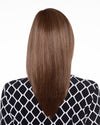 back side of a long Kinner Beauty Wigs wig on woman head 