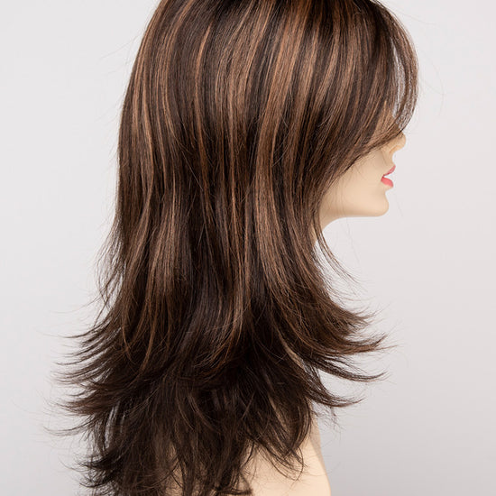 profile side of a long Kinner Beauty Wigs wig for woman on mannequin head 