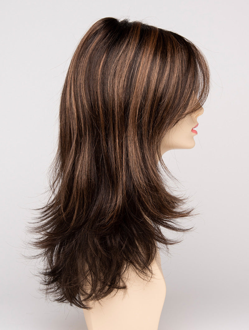 profile side of a long Kinner Beauty Wigs wig for woman on mannequin head 