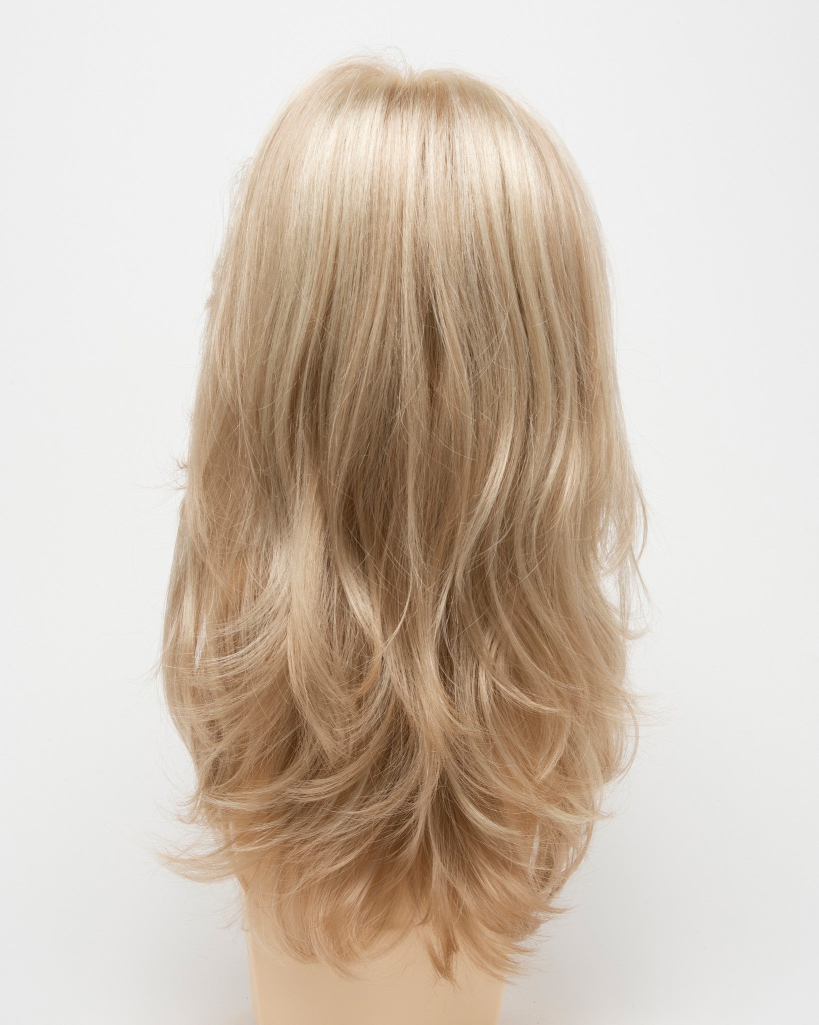 back side of a long Kinner Beauty Wigs wig for woman on mannequin head 