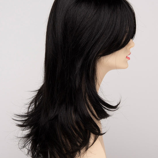 profile side of a long Kinner Beauty Wigs wig for woman on mannequin head 