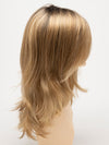 profile side of a long Kinner Beauty Wigs wig for woman on mannequin head 