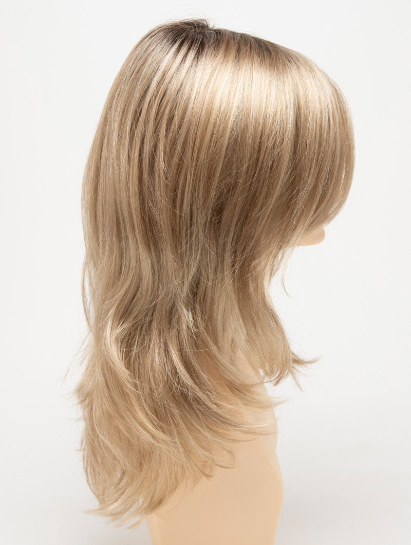 profile side of a long Kinner Beauty Wigs wig for woman on mannequin head 