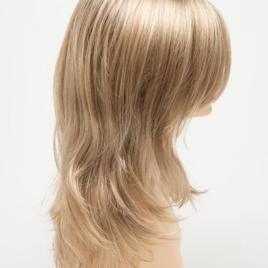 profile side of a long Kinner Beauty Wigs wig for woman on mannequin head 