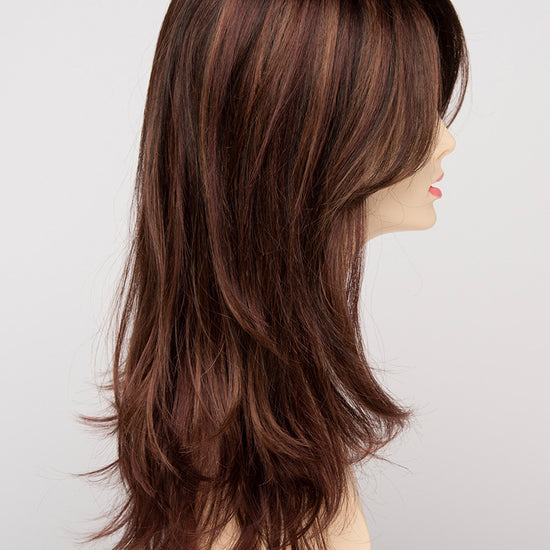 profile side of a long Kinner Beauty Wigs wig for woman on mannequin head 